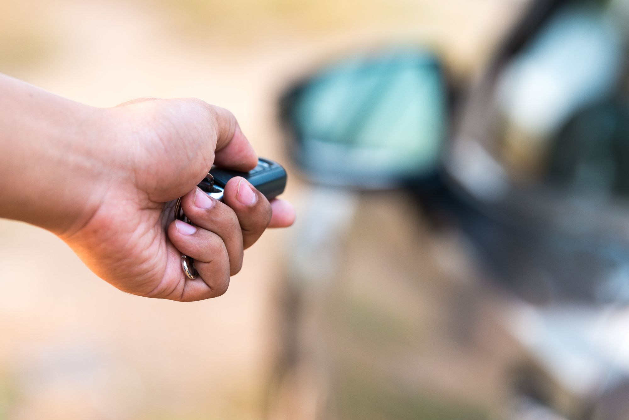 A person opening their car with a remote car key - if you are in need of a dui lawyer in Palm Beach County, FL.