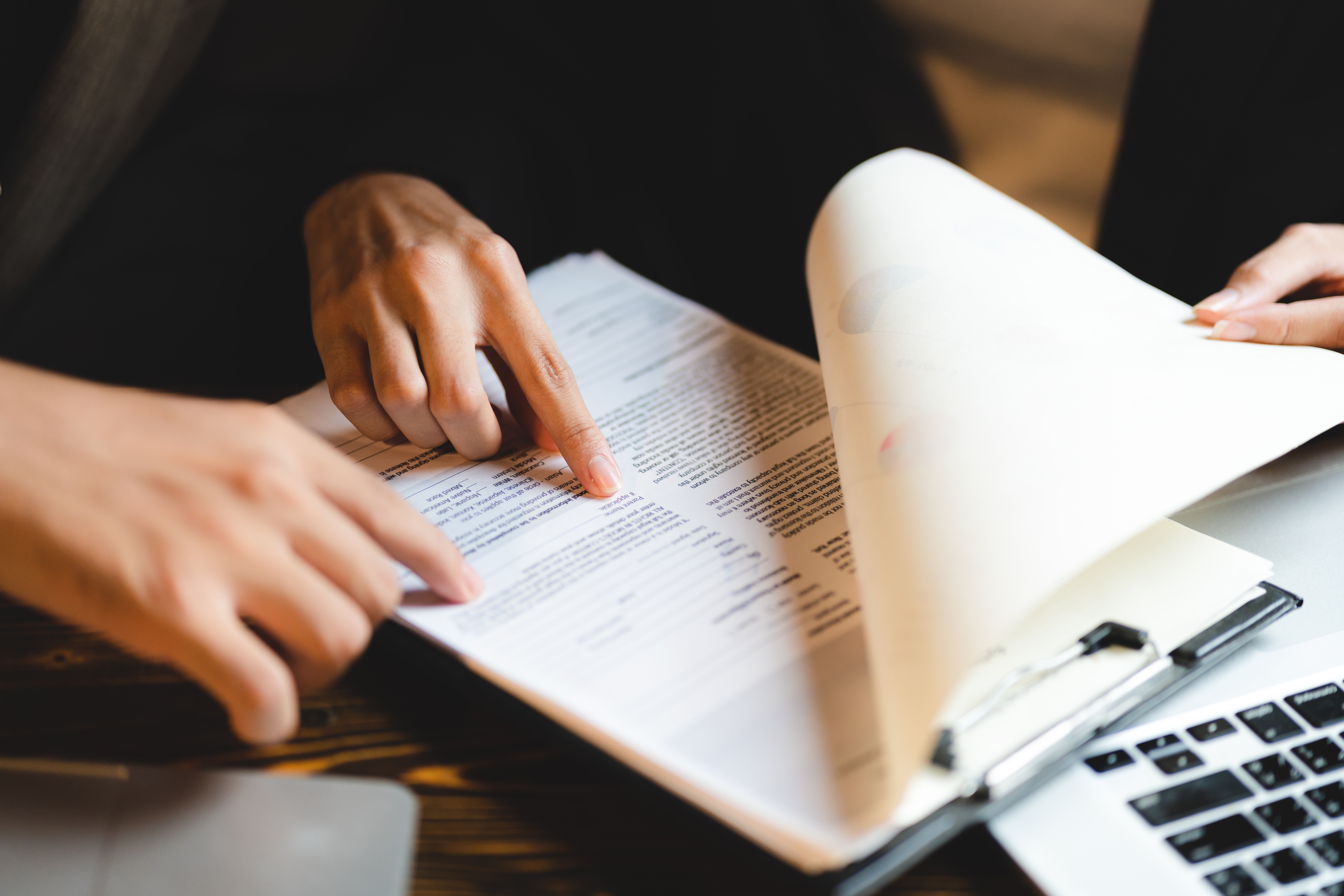 A criminal defense attorney helping a client with employment rights after a conviction.