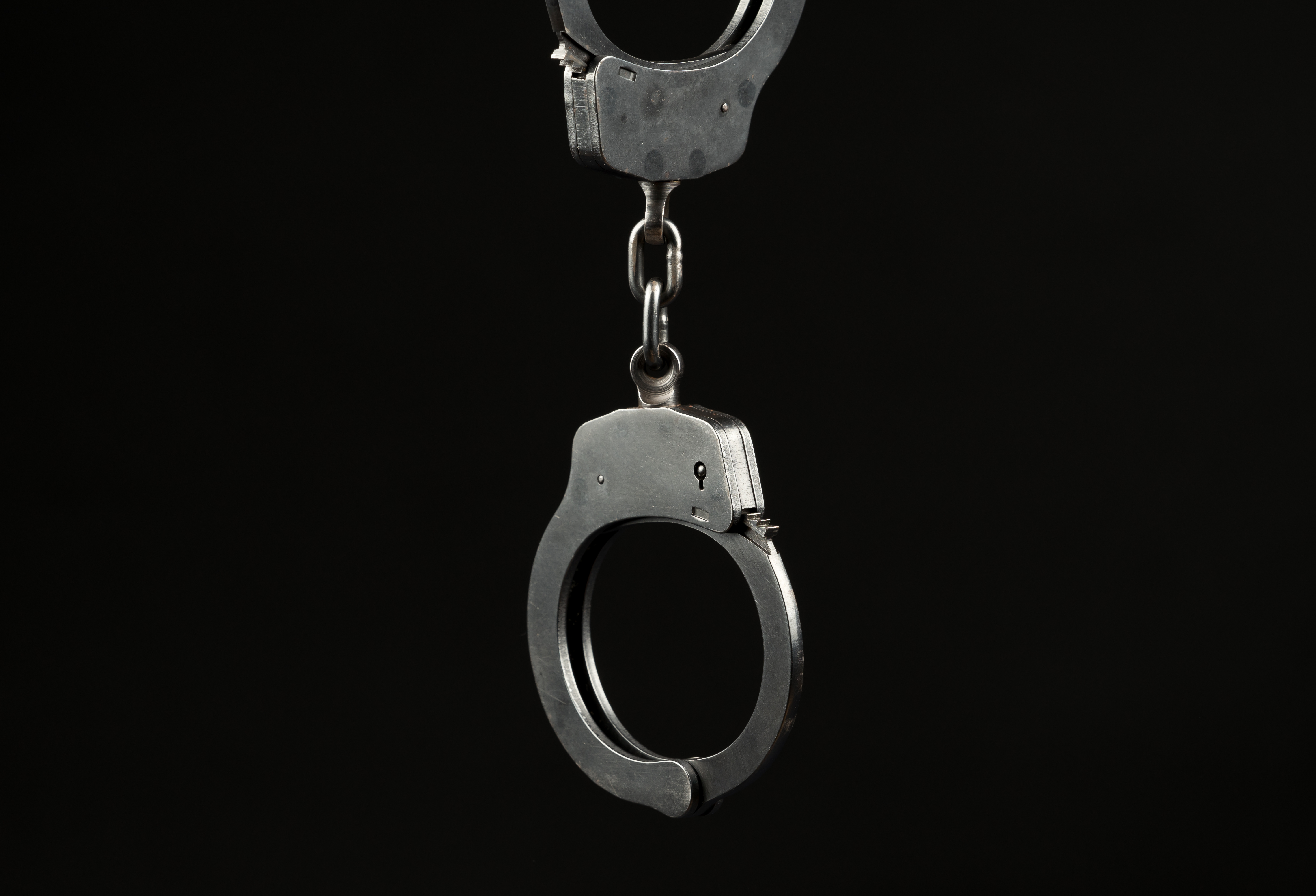 A pair of handcuffs from a criminal conviction - contact Peterford Law today for a criminal defense lawyer in Palm Beach County FL!